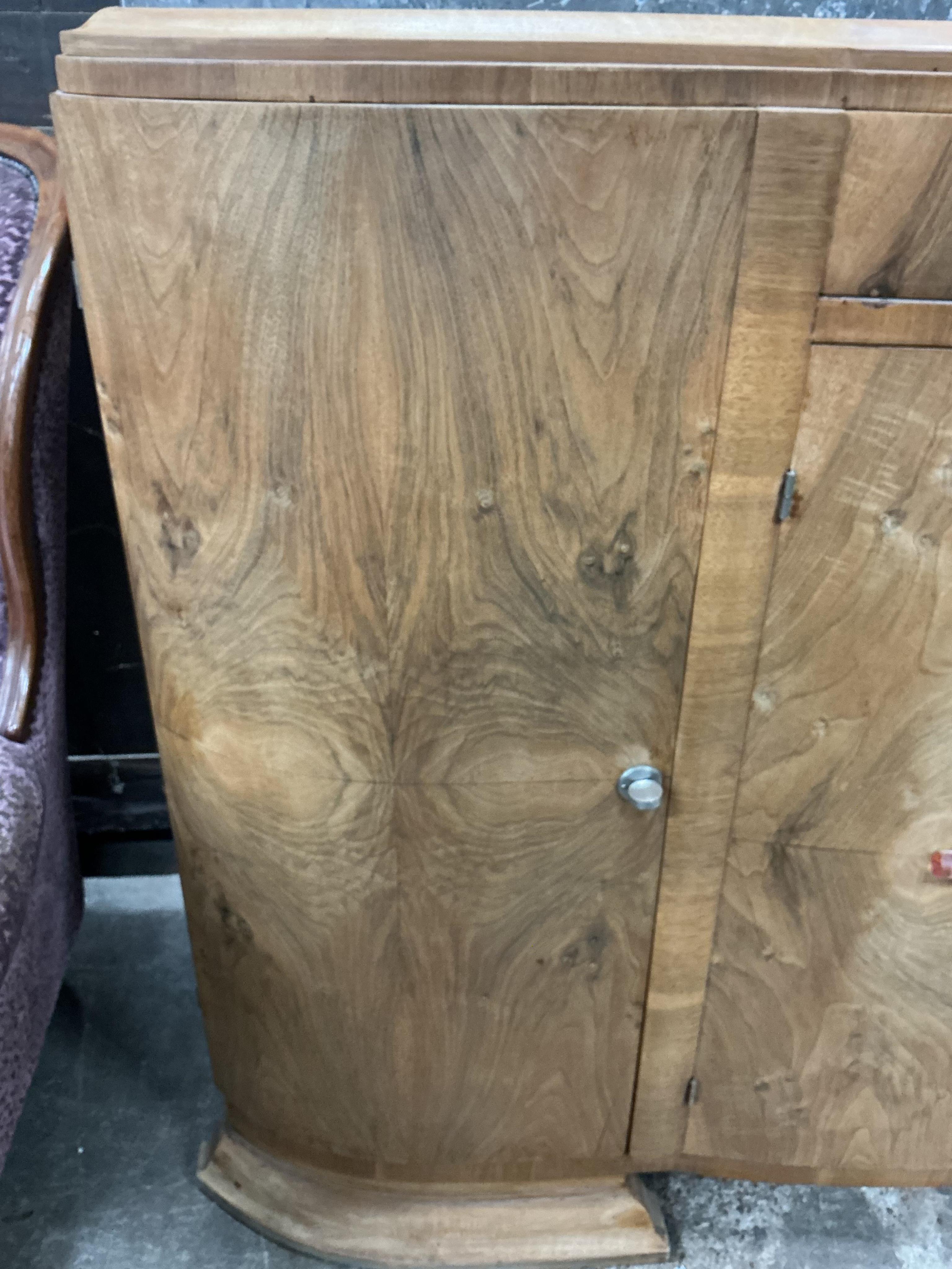 An Art Deco walnut marble topped bow front sideboard, width 158cm, depth 50cm, height 110cm